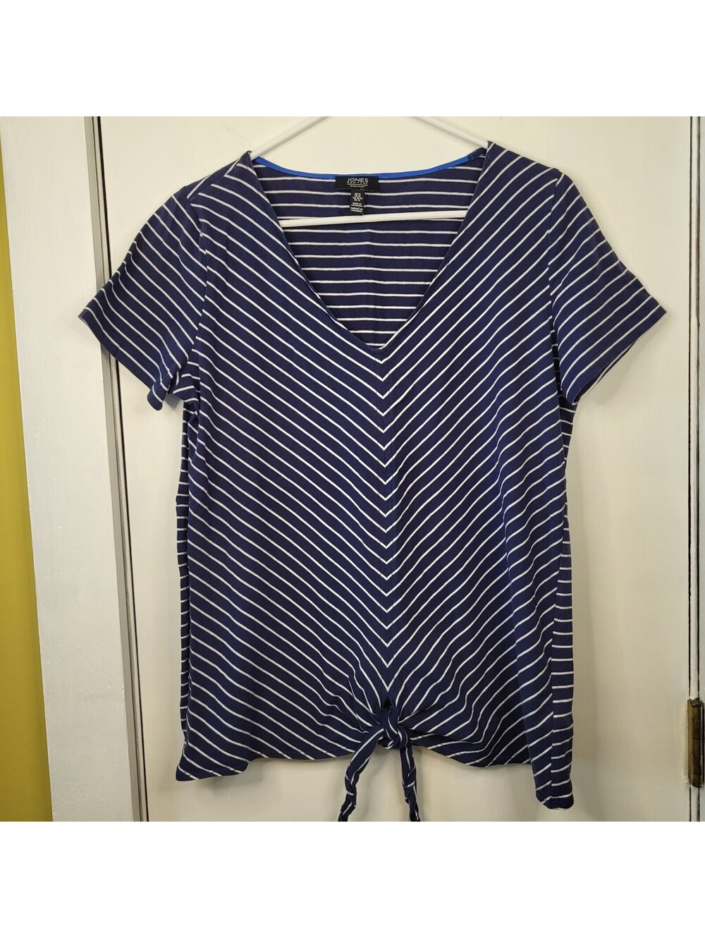 Jones New York striped V-neck top features a tie-front detail and casual styling